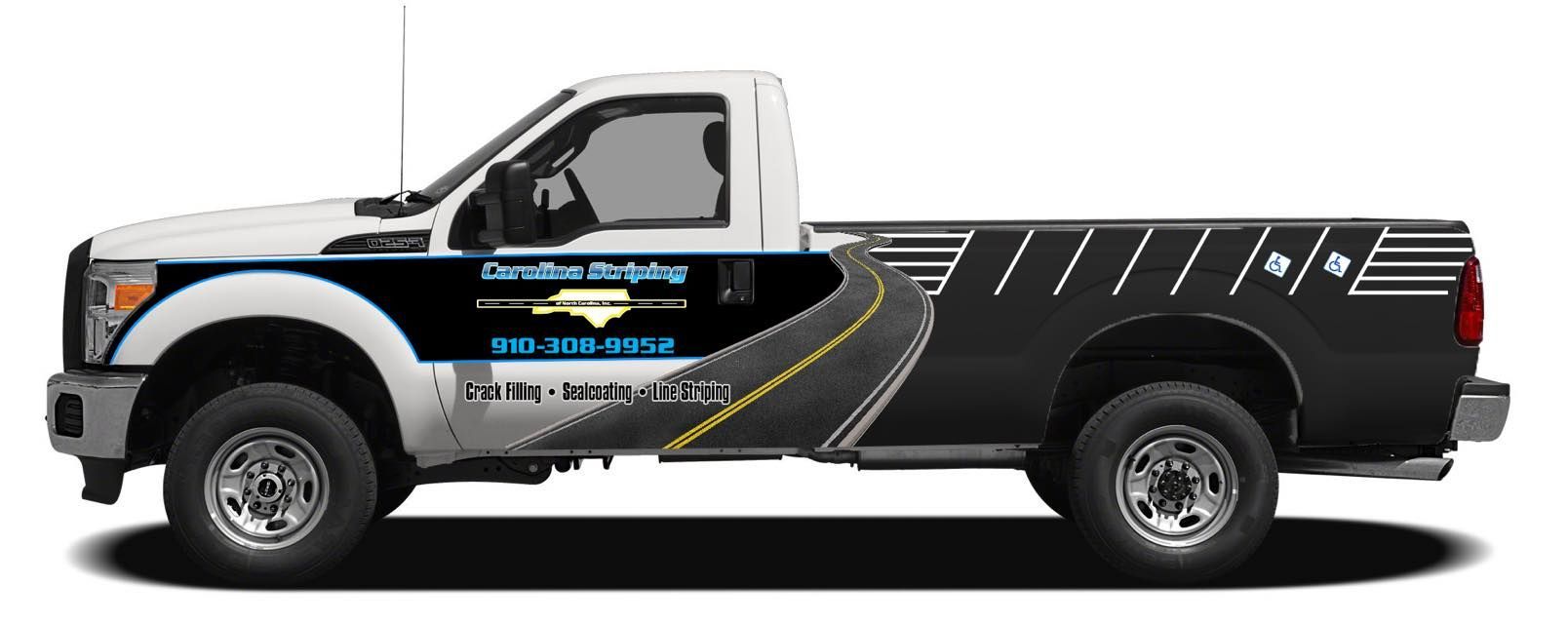 A side view of a white and black pickup truck with Carolina Striping graphics and a road design on the side panels.