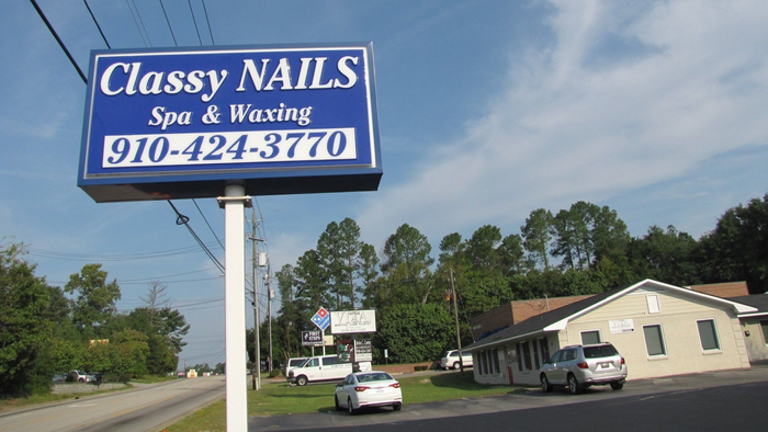A blue and white sign for
