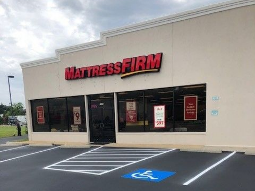 Mattress Firm storefront with accessible parking space and ramped entrance in Fayetteville NC
