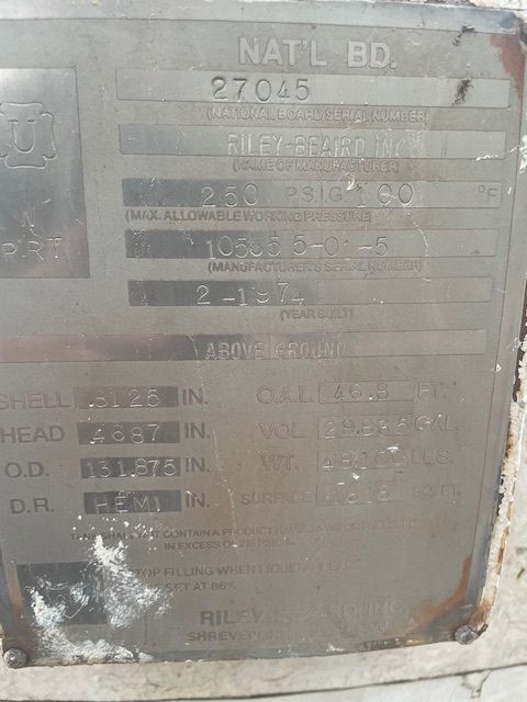 Metal plate with text and numbers; likely equipment specifications.