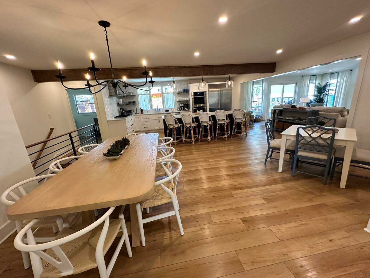 There is a large table and chairs in the middle of the room.