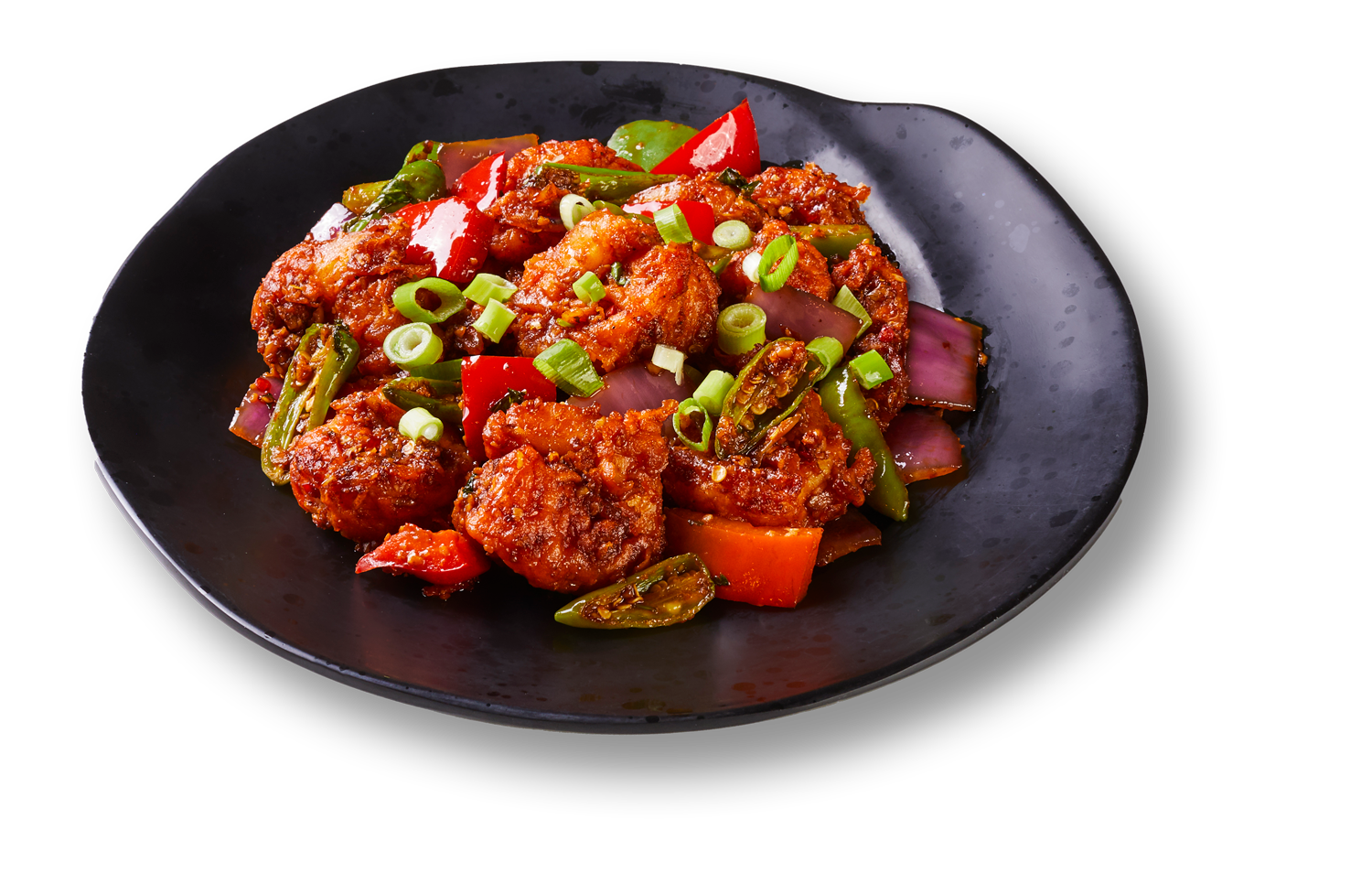 A black plate topped with chicken and vegetables on a white background.