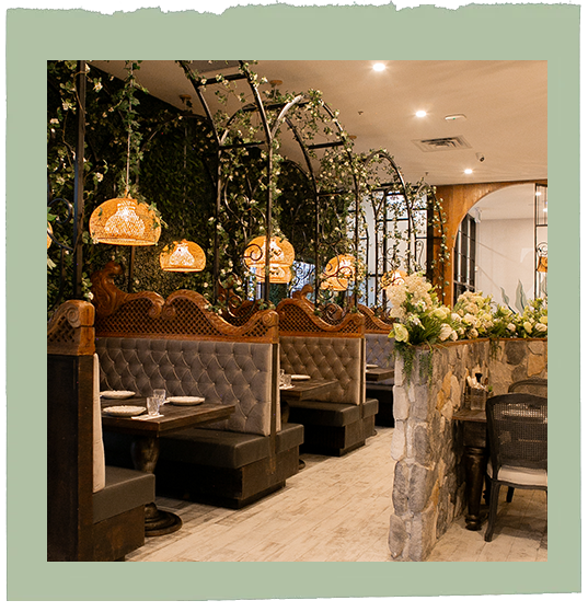 A picture of a restaurant with tables and benches.