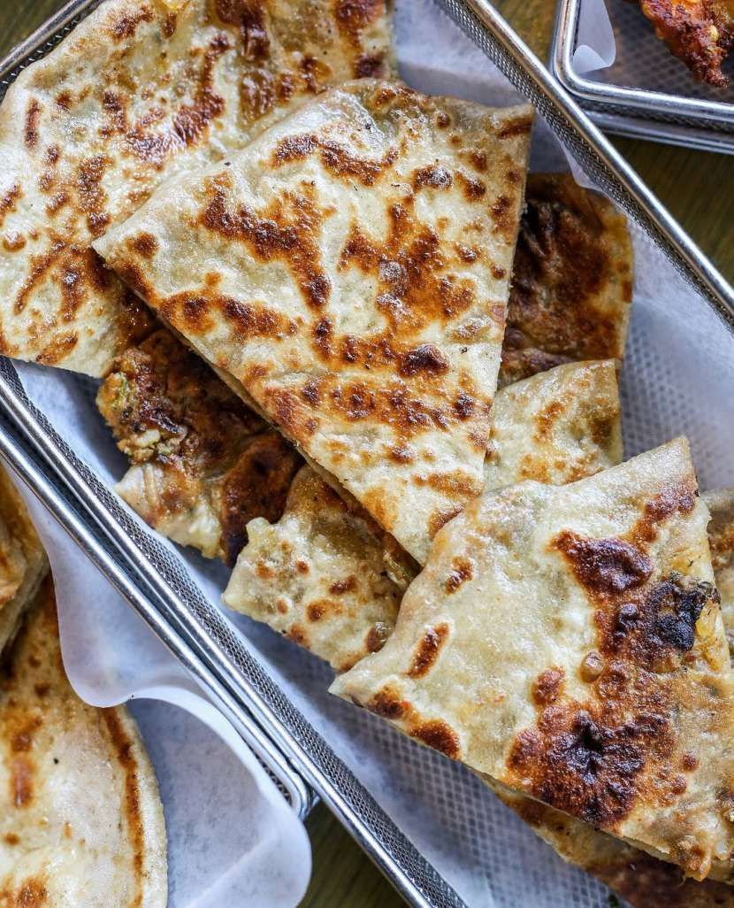 A close up of a tray of food on a table.