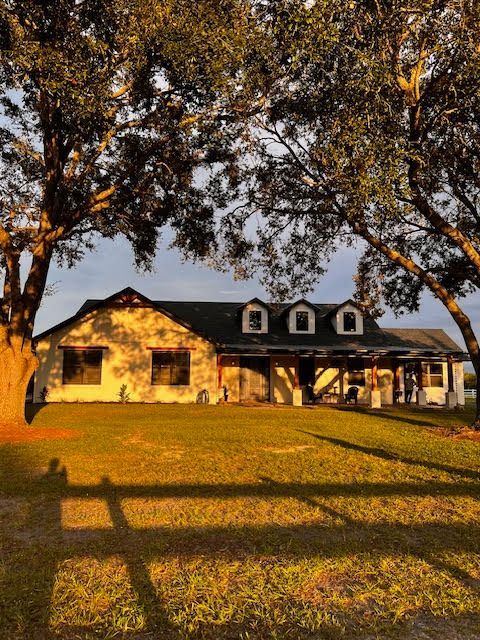 A house with a tree in front of it