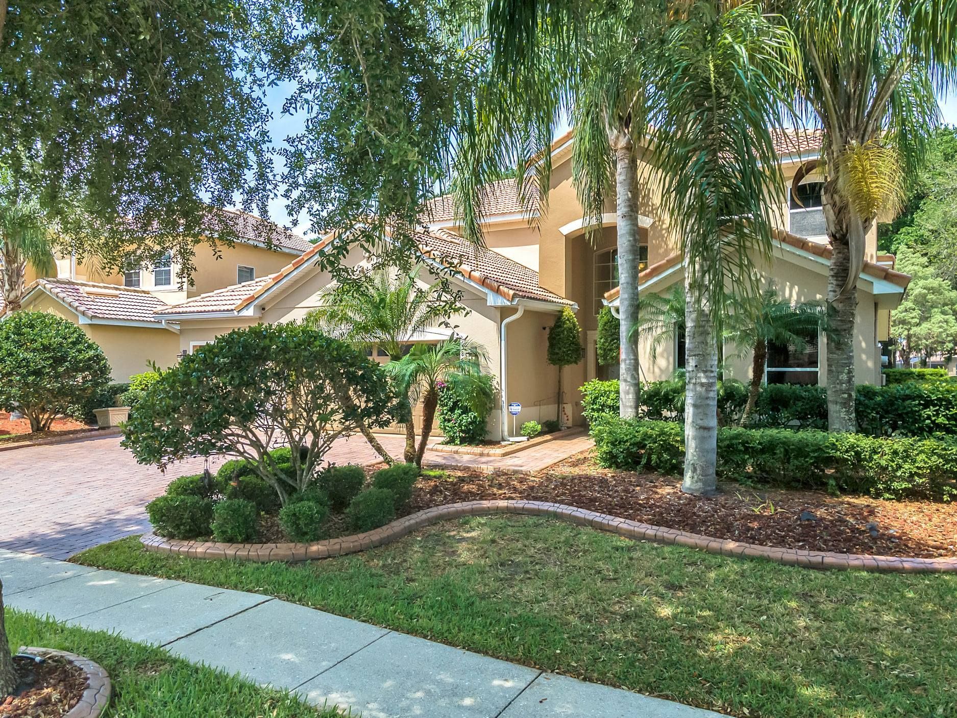 A large house with a lot of trees in front of it