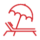 Red beach chair with umbrella, representing a relaxing summer vacation.
