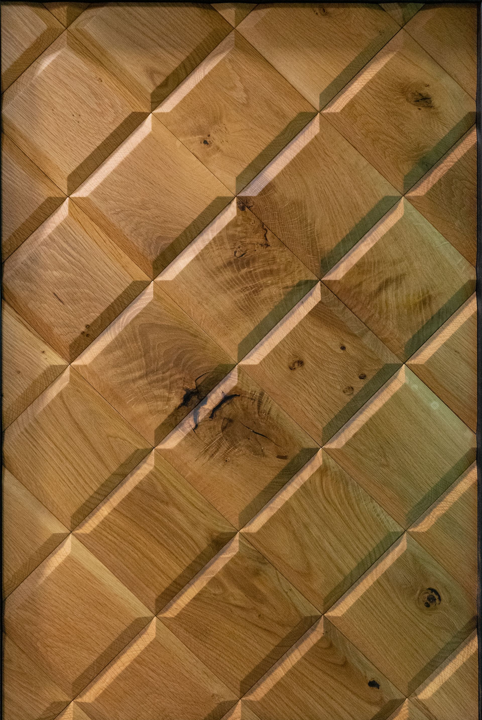 A close up of a wooden surface with a geometric pattern.