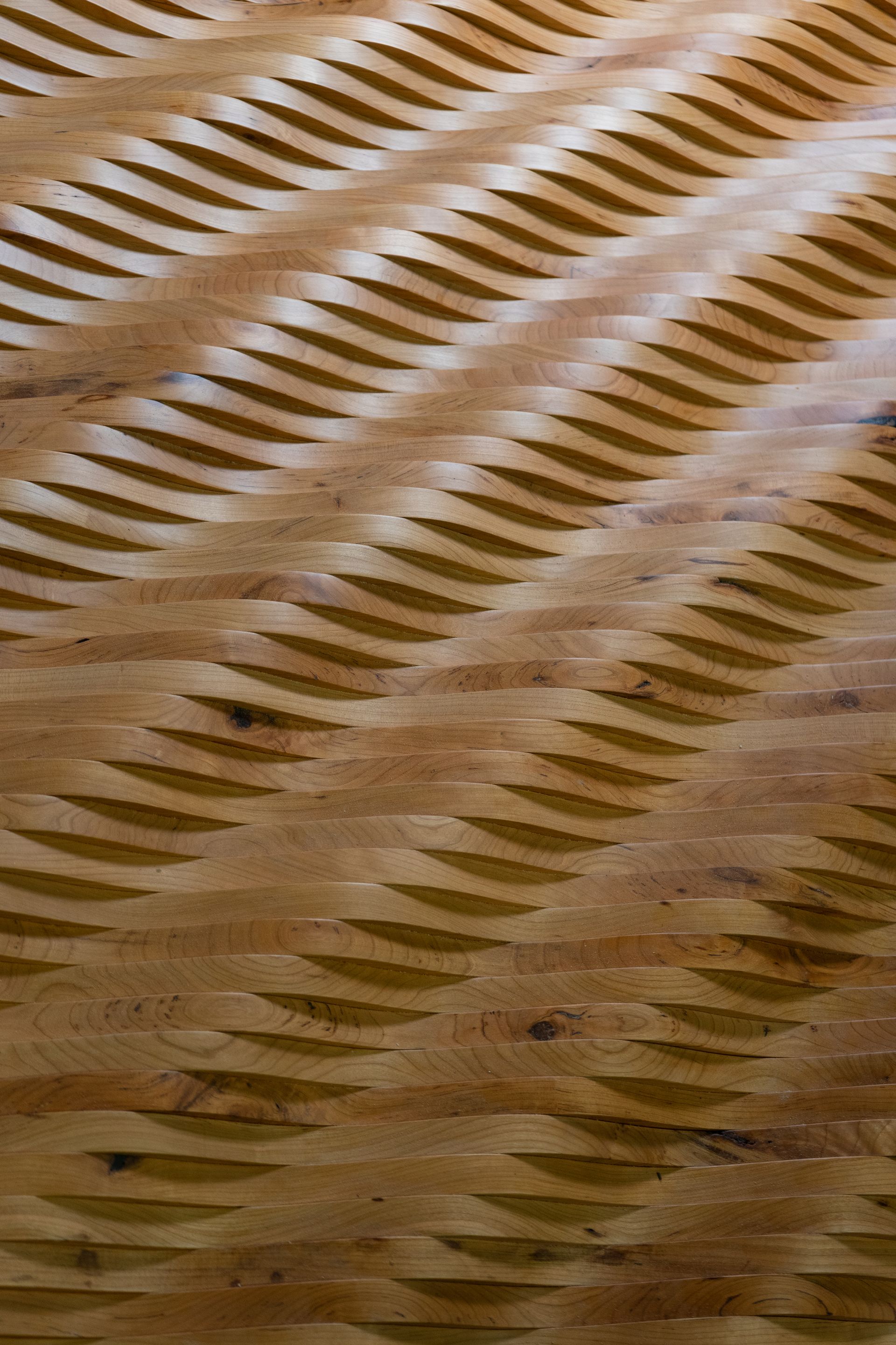 A close up of a wooden floor with a pattern on it.