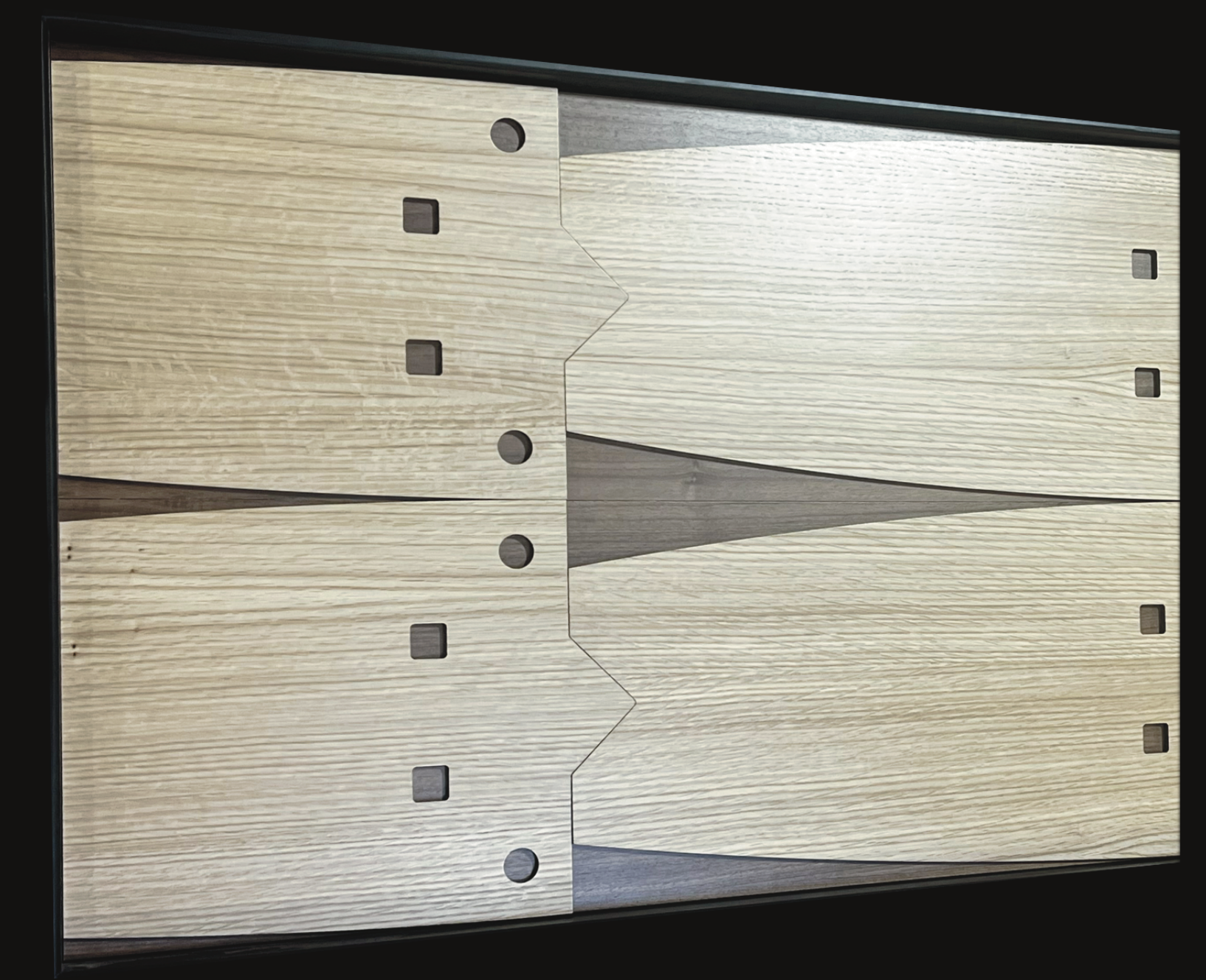 A close up of a piece of wood with holes in it