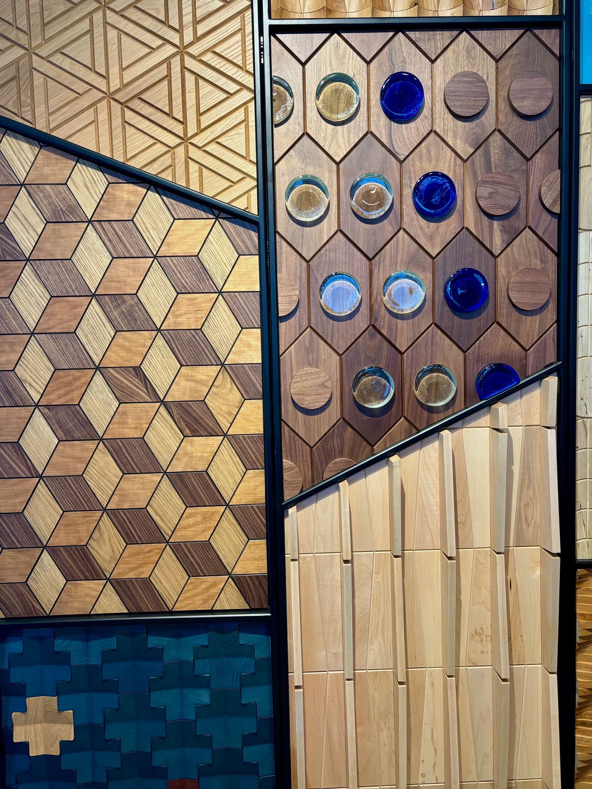 There are many different types of wooden tiles on the wall.