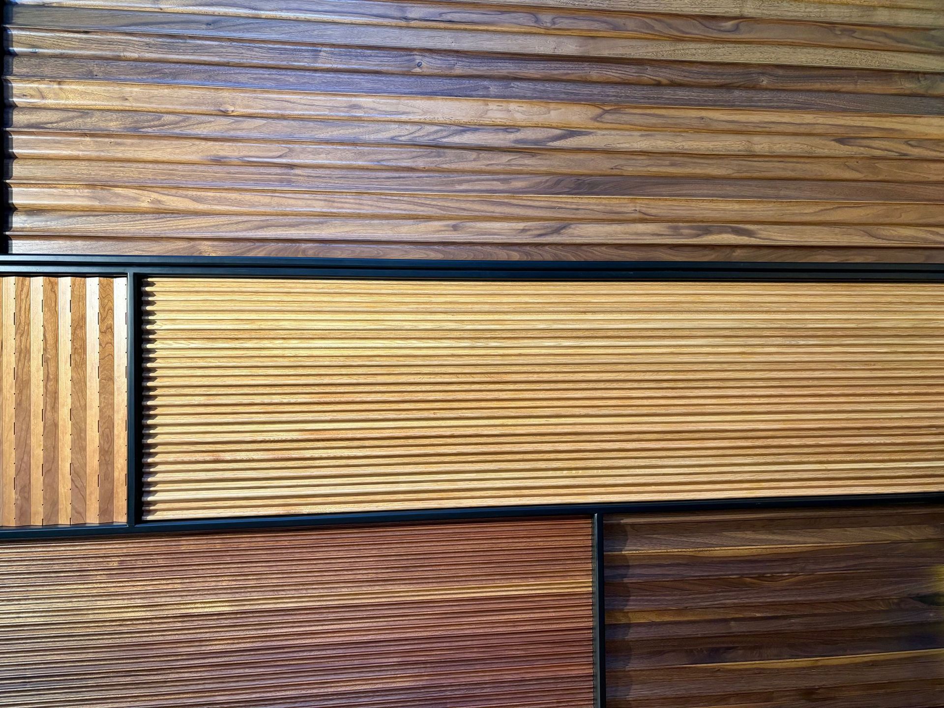 A close up of a wooden wall with different types of wood