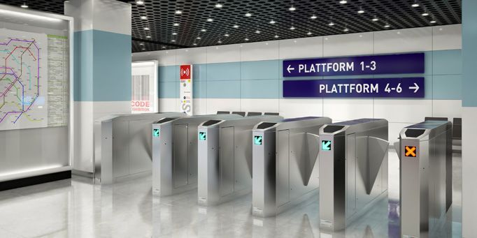 Una fila de torniquetes están alineados en una estación de metro.