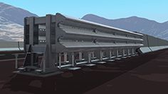 Un tren está parado en las vías con montañas al fondo.