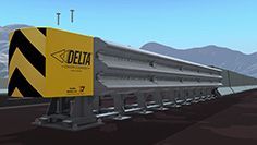 Un tren pasa por las vías con montañas al fondo.