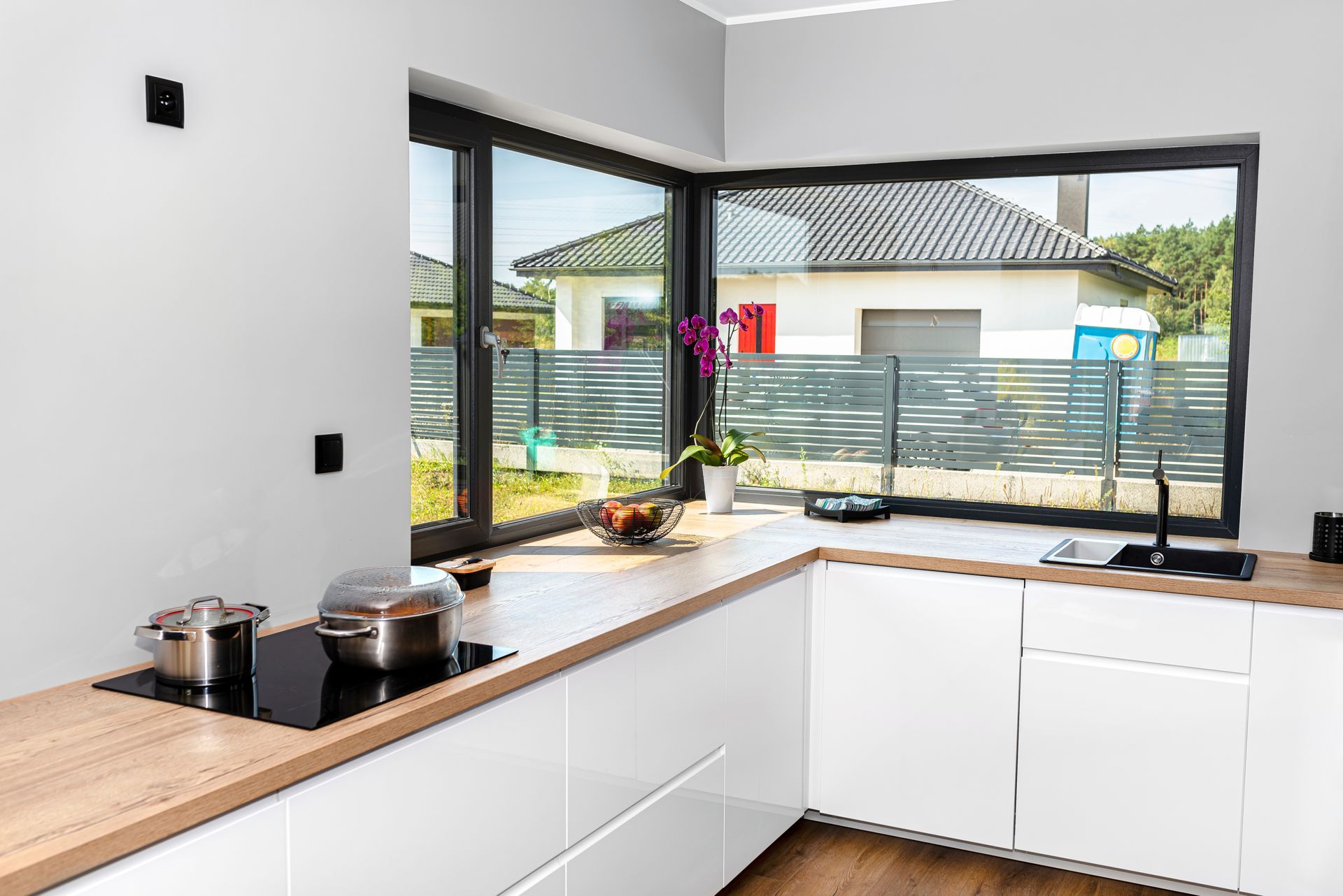 Corner window in modern kitchen.