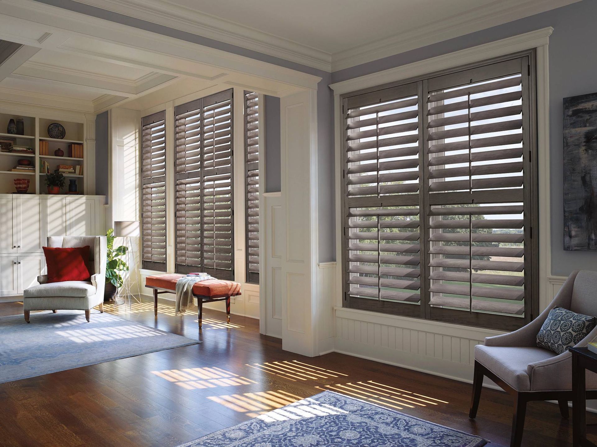 Hunter Douglas shutters blocking light in a modern living room near Austin, TX