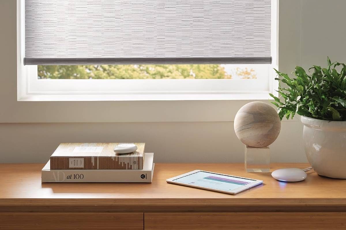 Wooden end table with Hunter Douglas PowerView® Automation system hardware set on top of it