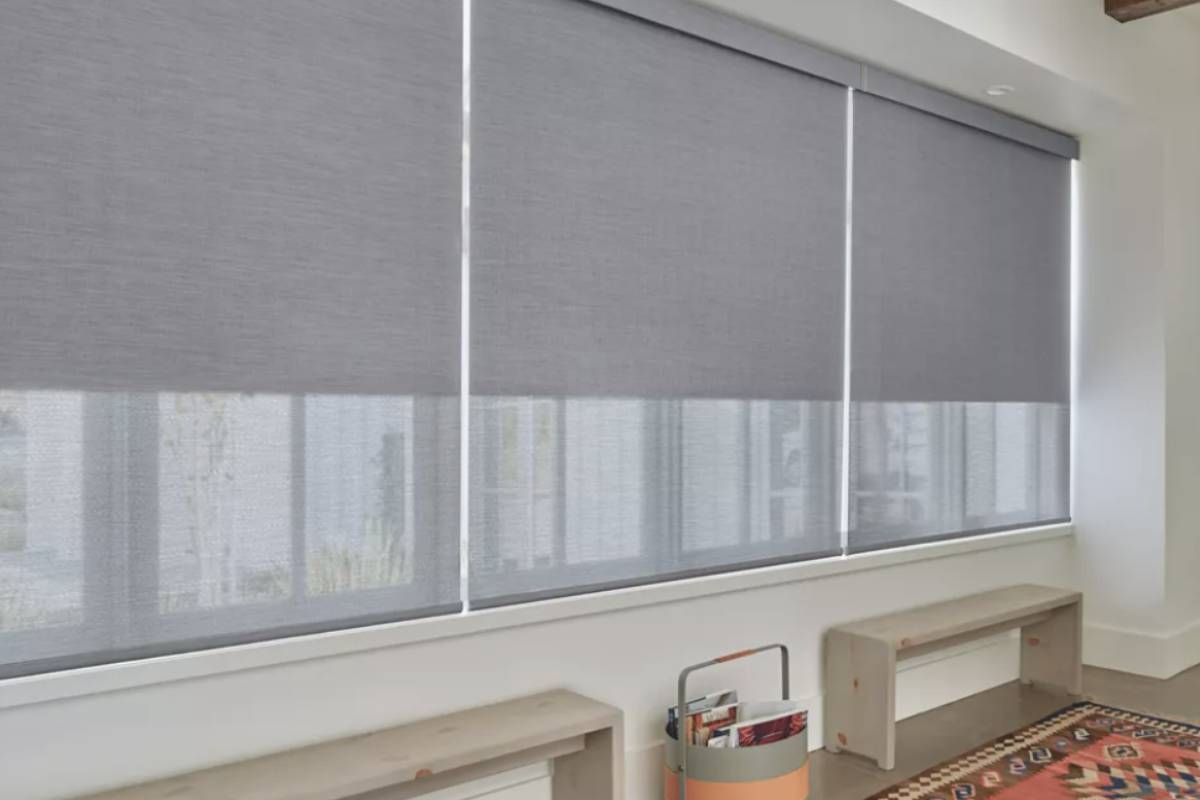 Hunter Douglas roller shades covering a window in a home near Austin, TX