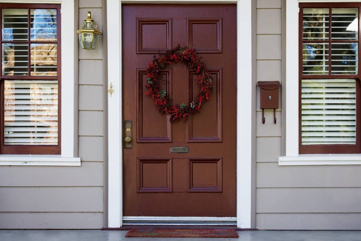 Suburban home front door with gorgeous window treatments