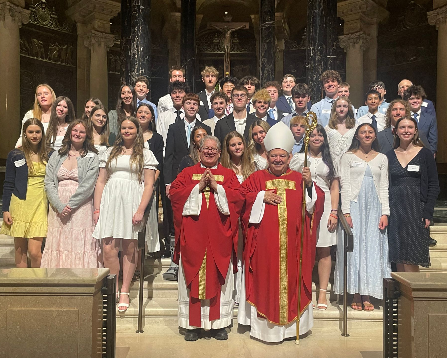 Christ the King confirmands smiling with Archbishop Hebda and Fr. Erich at the Cathedral of St. Paul.
