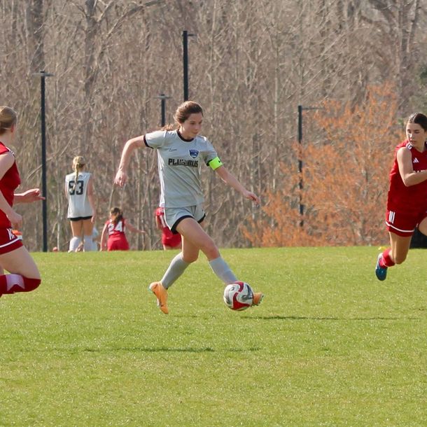 A soccer player in a grey jersey from BRYC Academy