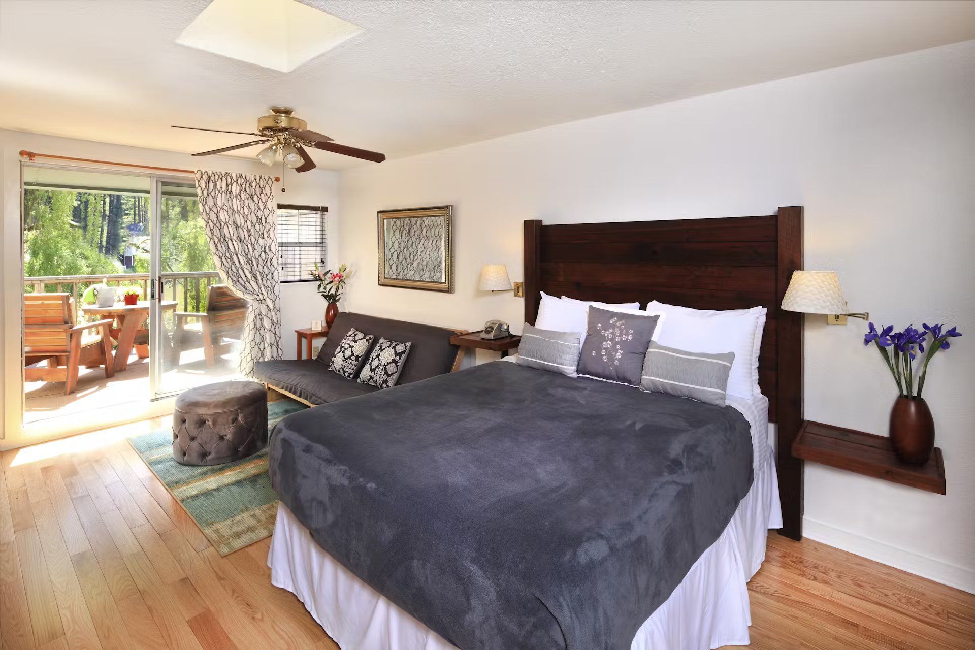 A bedroom with a king size bed and a couch