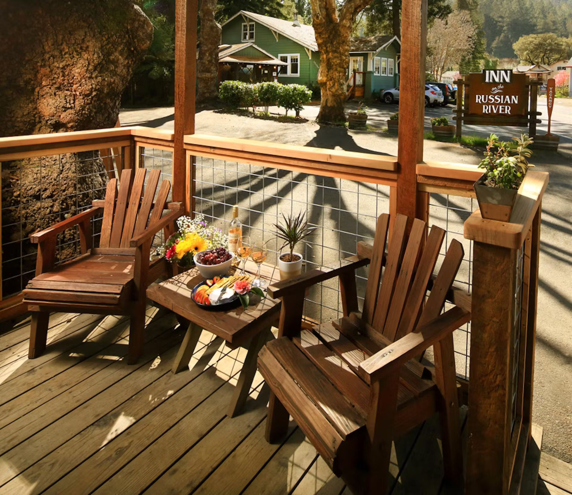A wooden deck with a sign that says inn on it