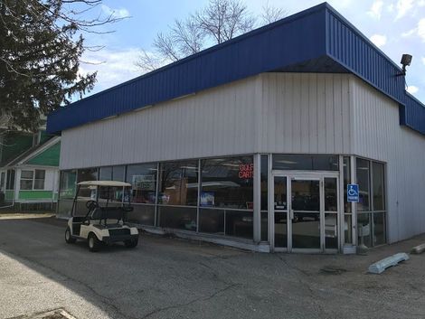 A White Golf Cart Is Parked At The Front Of The Store - Chesterton, IN - Lan Cam Inc A White Golf Cart Is Parked At The Front Of The Store - Chesterton, IN - Lan Cam Inc