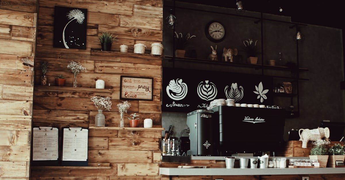 The interior of a cafe, displaying custom wood walls, decor, and appliances.