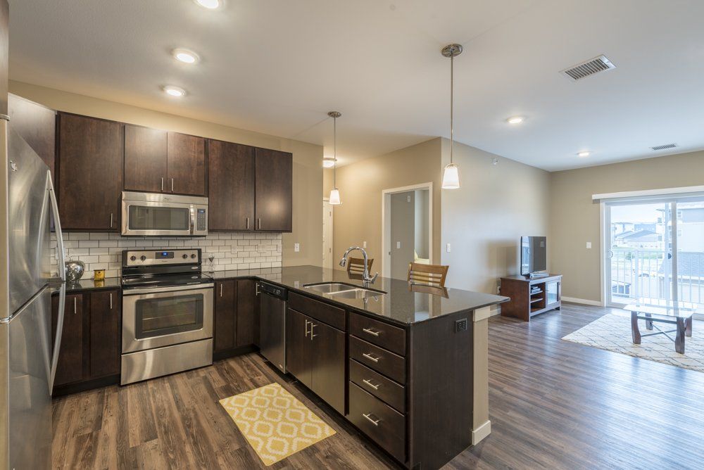 Kitchen looking into living room and sliding glass door to patio