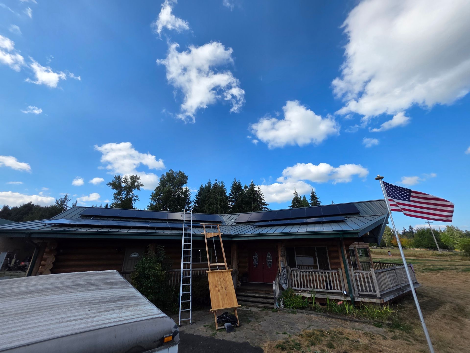 Suburban house with solar panels on the roof at sunset