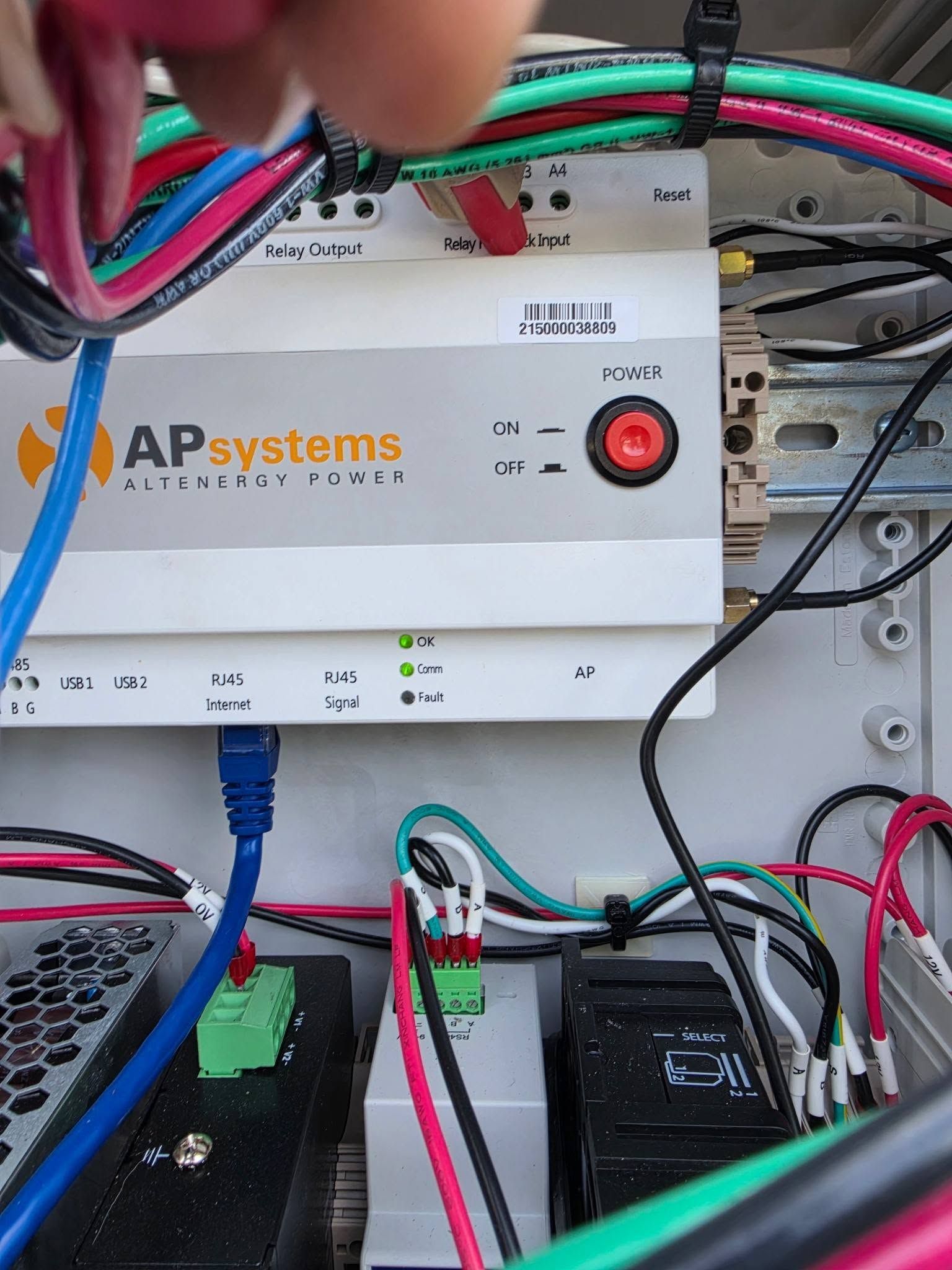 APsystems solar inverter with connected cables and wiring inside an electrical cabinet