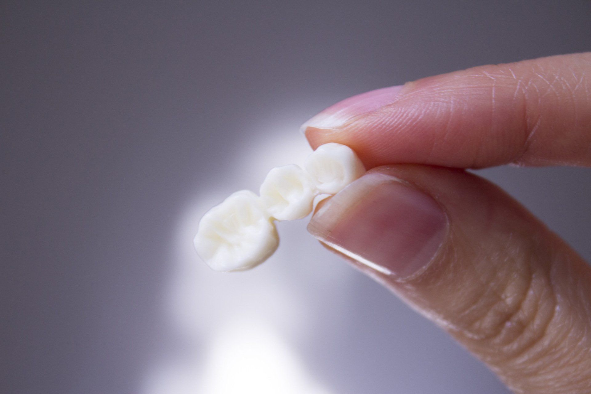 Dental bridge being held
