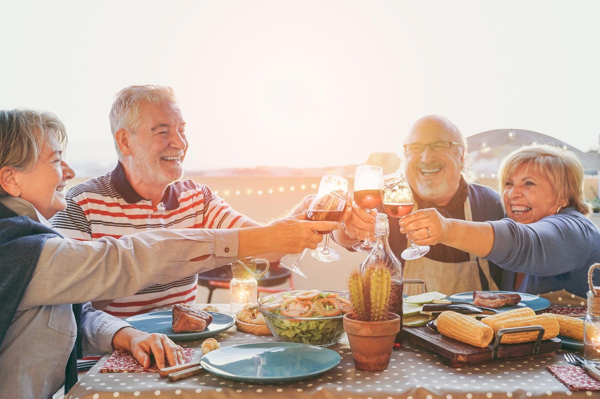 Older couples toasting