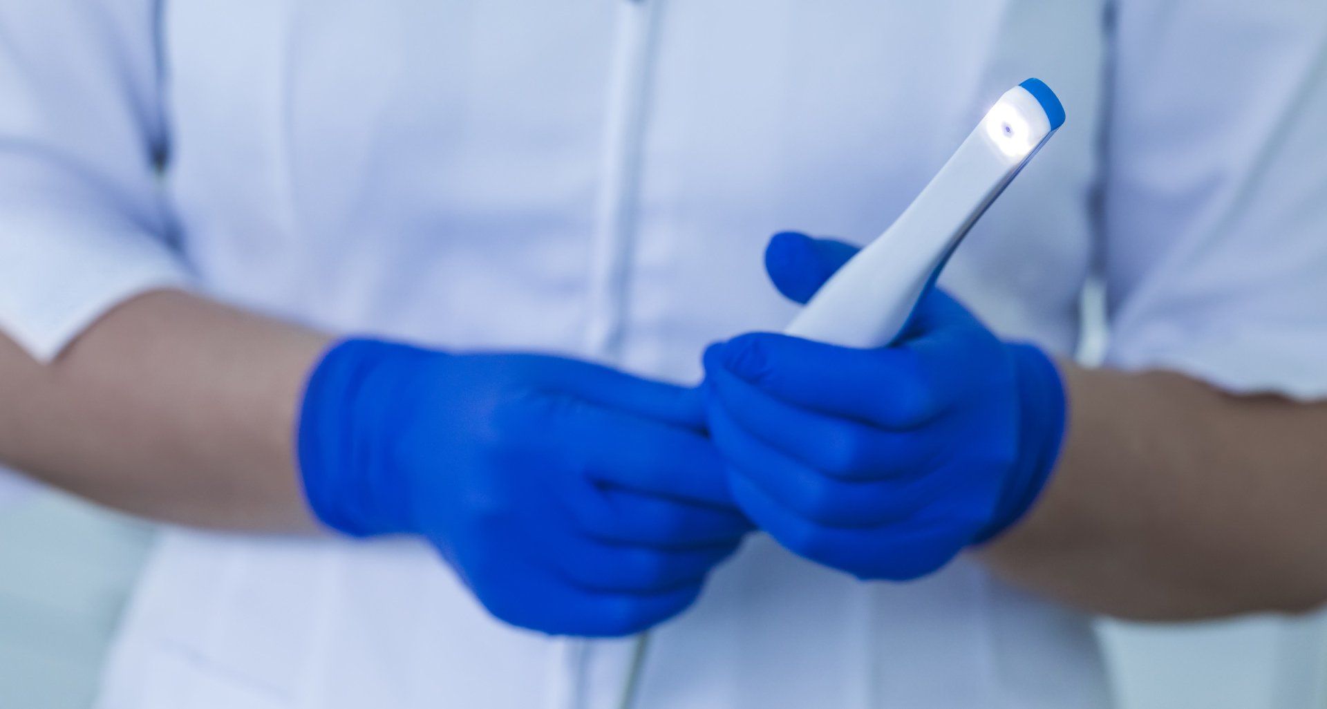 Doctor holding Intra-Oral camera