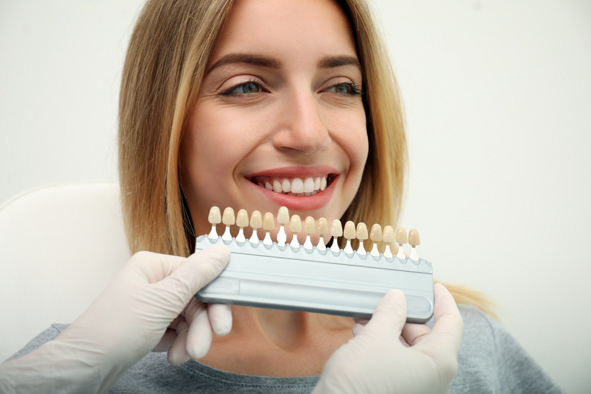 Women picking out veneer color 
