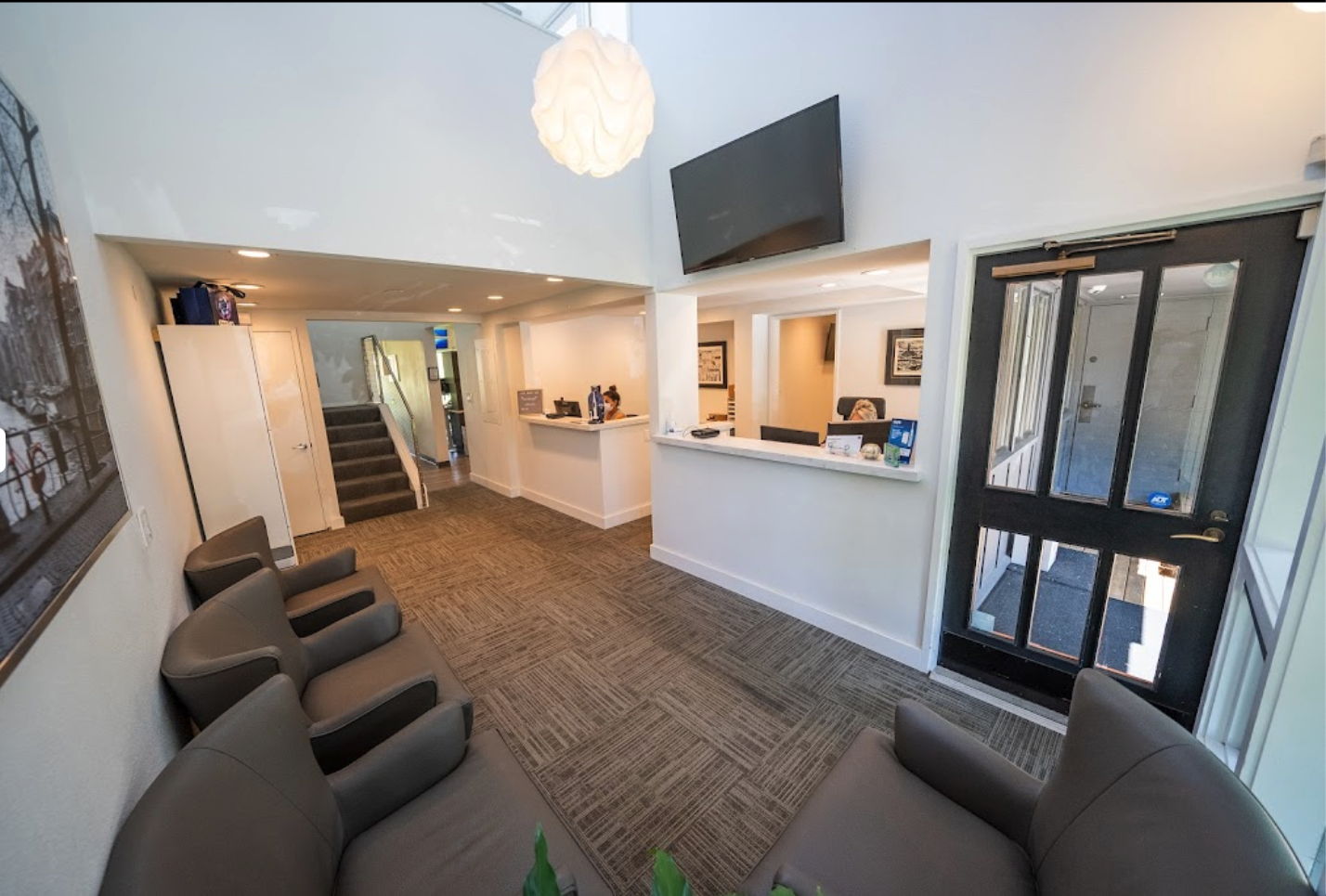 Waiting room with chairs and TV