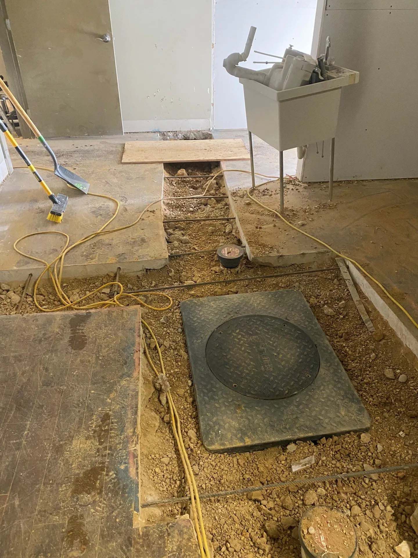 A septic system construction with yellow wires around it