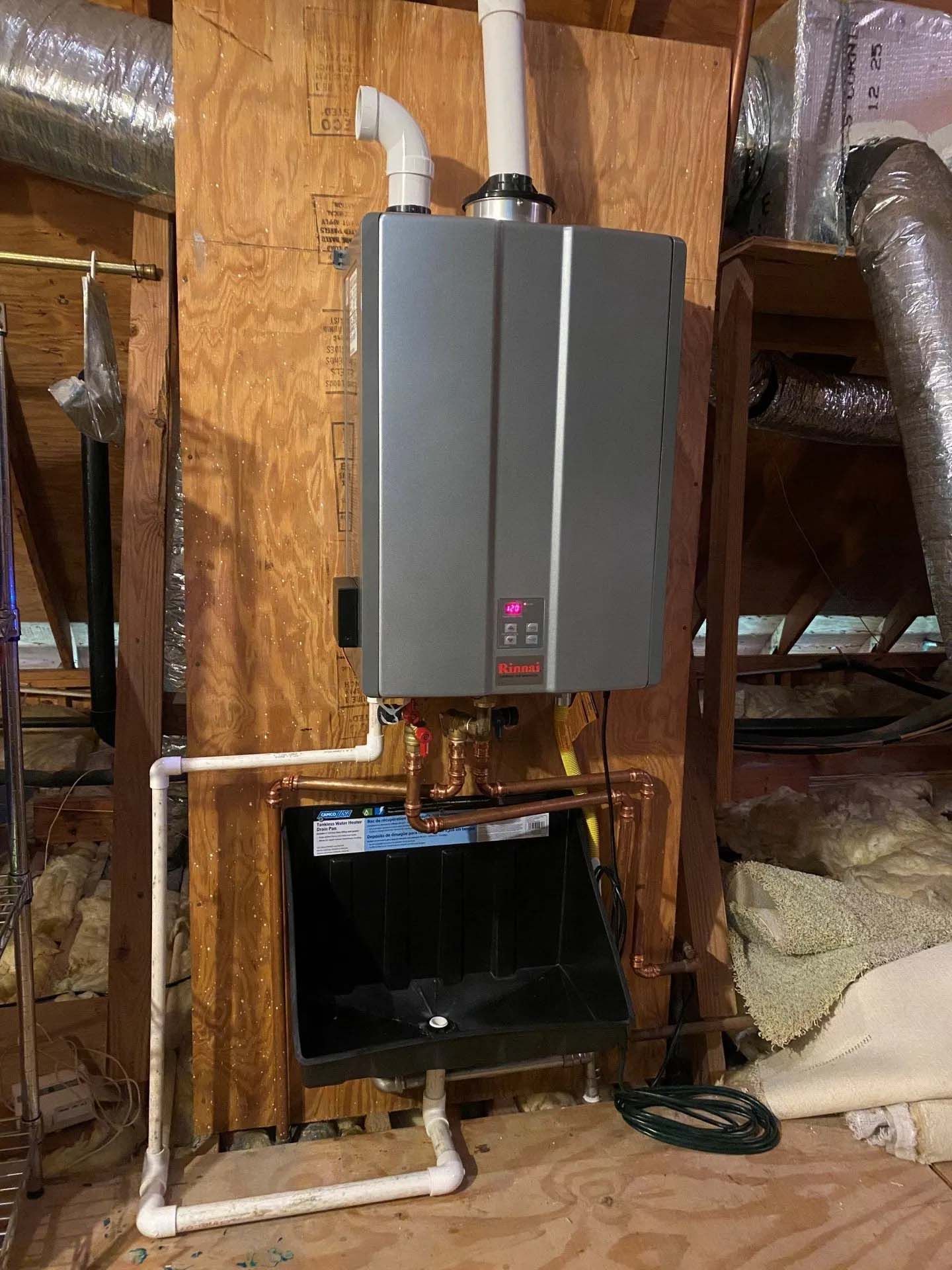 A water heater is installed in the attic of a house
