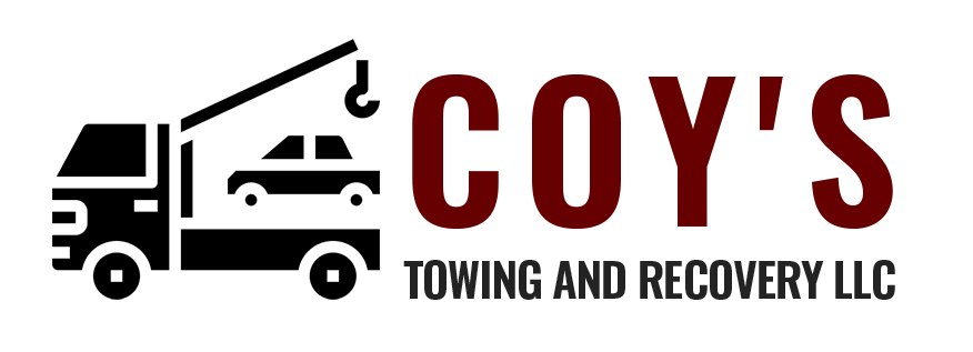 The logo for coy 's towing and recovery llc shows a truck with a crane attached to it.