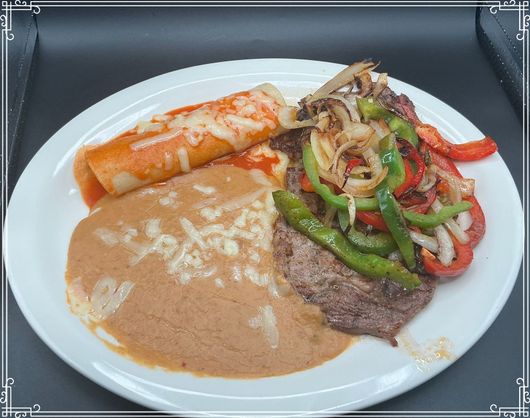 Plate of Mexican food: enchilada, meat with peppers & onions, and creamy beans.