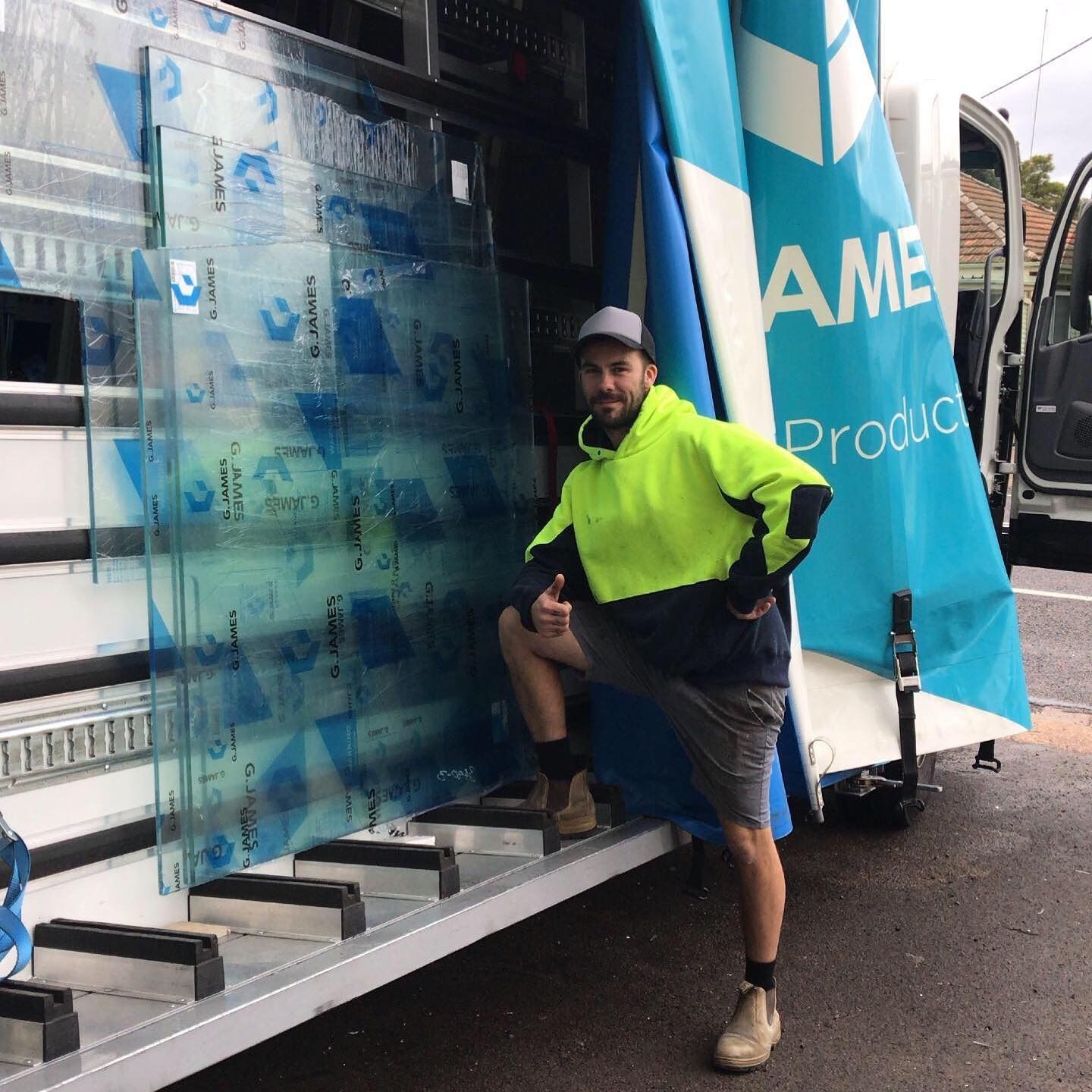 Worker Beside of Glass Panels in Cessnock
