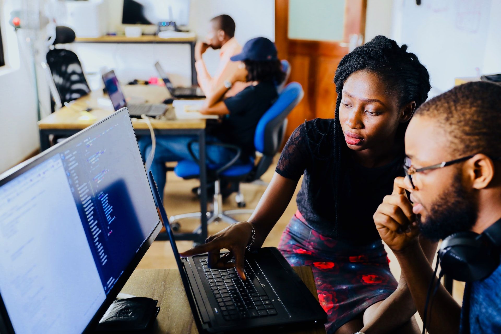 Image of people in an industry using a cloud computer