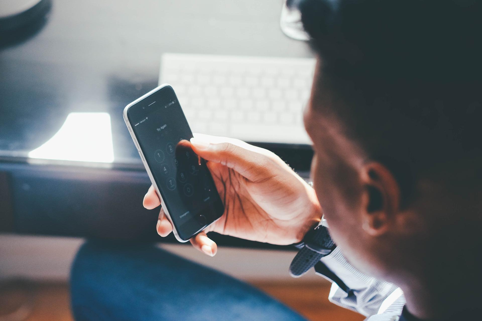 Image of a person looking at their mobile phone