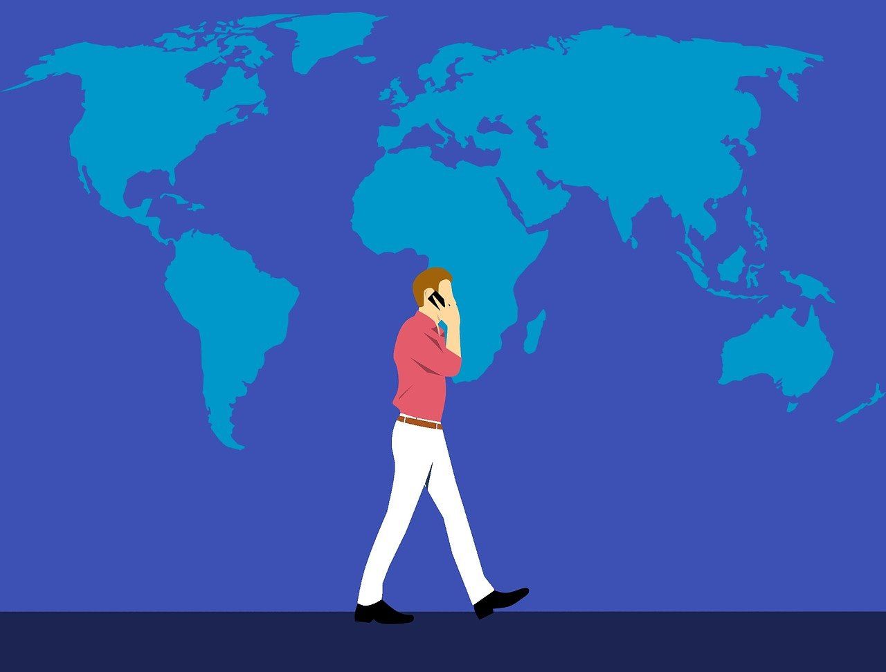 Image of a man talking on the phone with a map of the world behind him