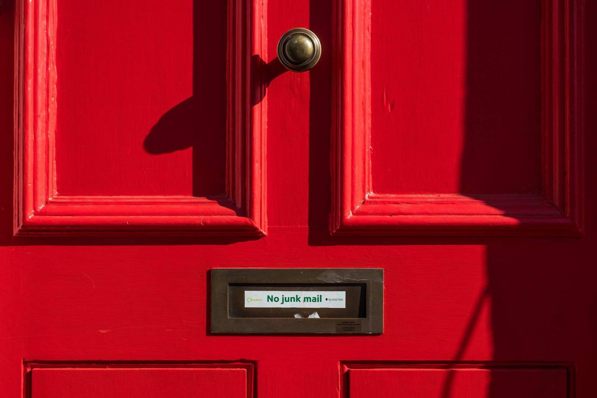 door and mailbox that says no junk mail