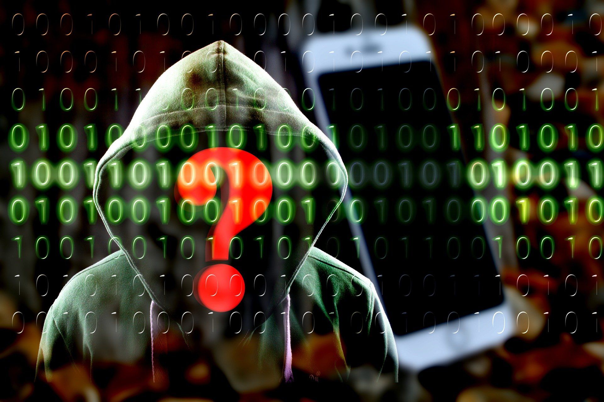 Image of computer binary code and a hacker behind it