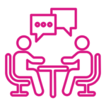 Two people are sitting at a table with speech bubbles.