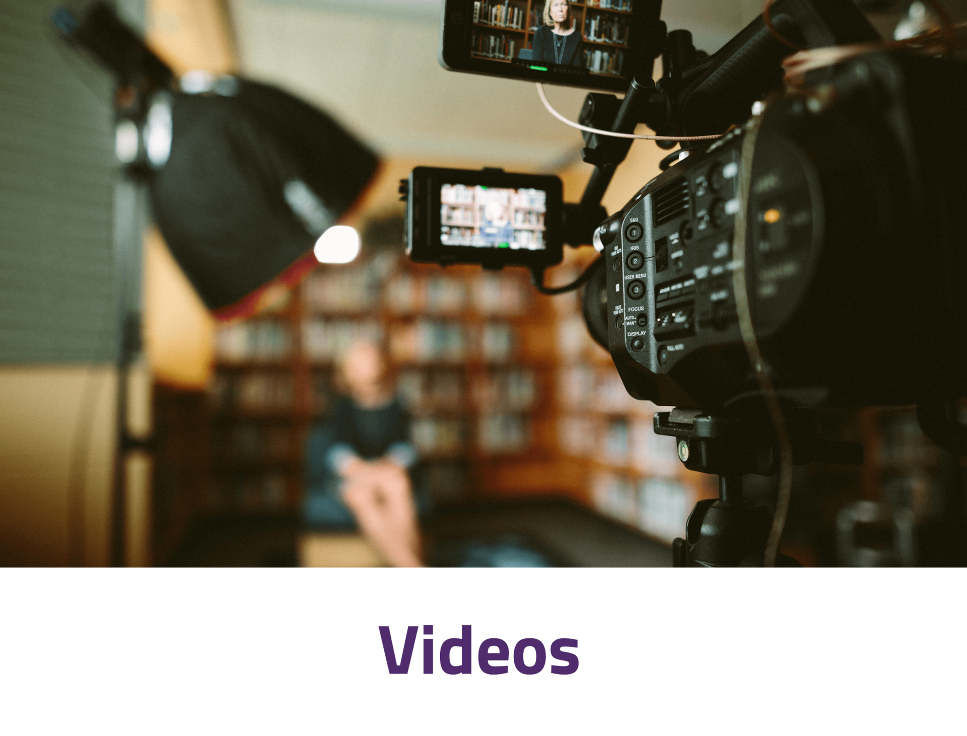 A video camera is taking a picture of a person in a room.